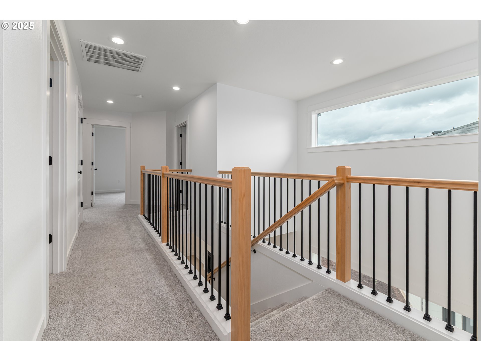 2263 Southwest Phyllis Place Gresham, OR 97080 - Photo 19 of 34 a view of a hallway with windows