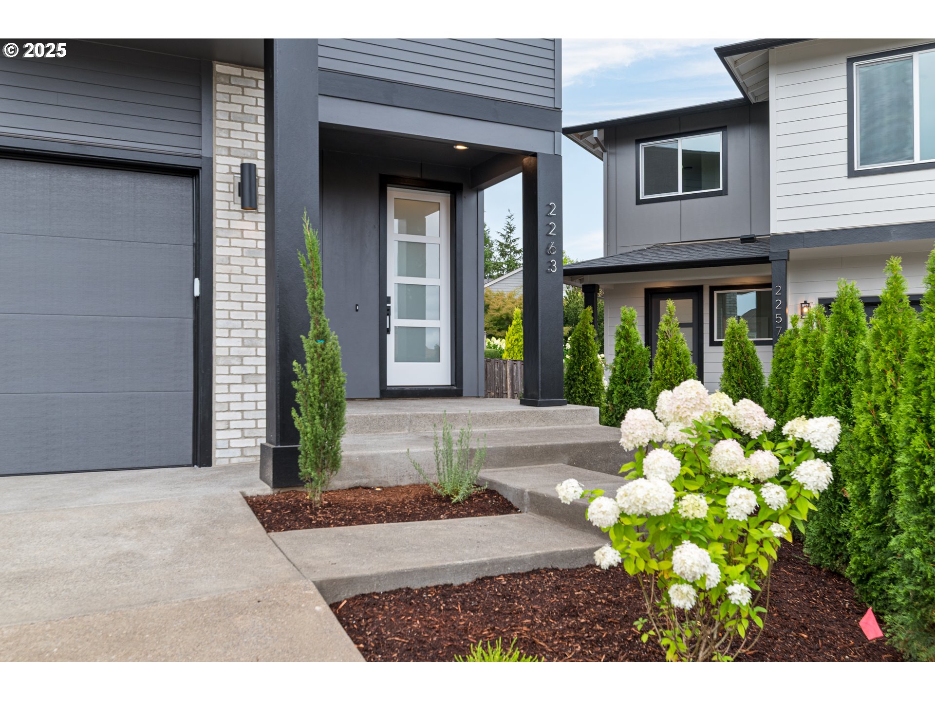 2263 Southwest Phyllis Place Gresham, OR 97080 - Photo 3 of 34 a front view of a house with garden