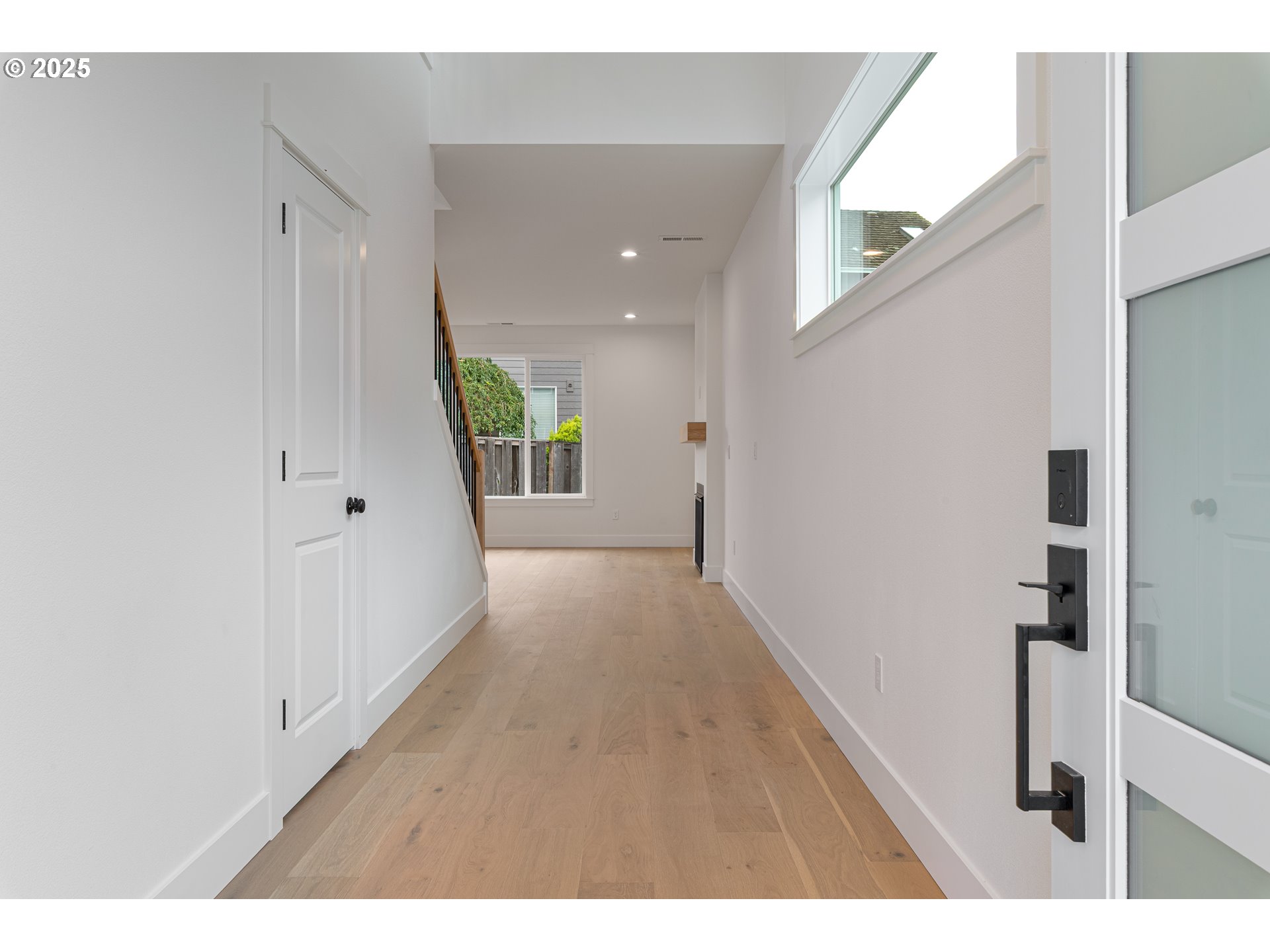2263 Southwest Phyllis Place Gresham, OR 97080 - Photo 5 of 34 a view of a hallway with wooden floor and staircase