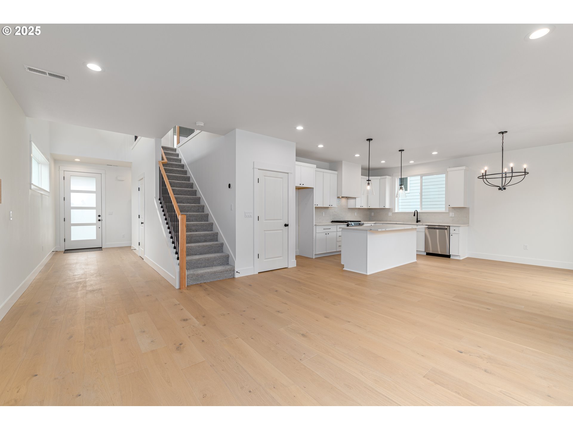 2263 Southwest Phyllis Place Gresham, OR 97080 - Photo 6 of 34 a view of a kitchen with a sink and dishwasher wooden floor