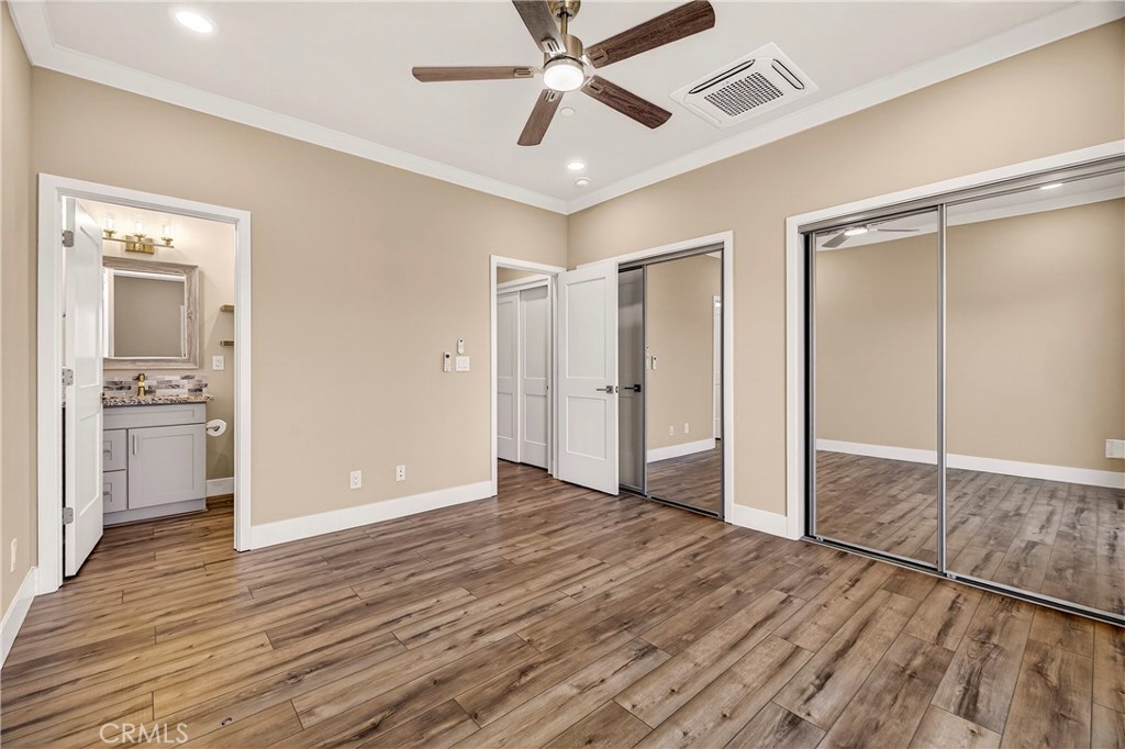 5617 Scottwood Road Paradise, CA 95969 - Photo 20 of 55 a view of an empty room and kitchen view with wooden floor