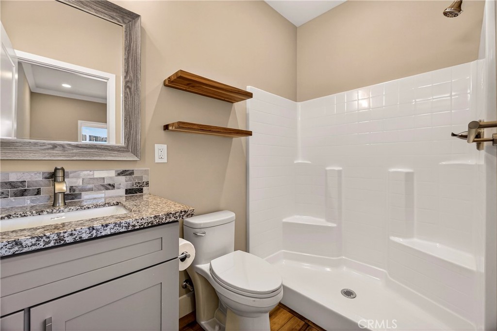 5617 Scottwood Road Paradise, CA 95969 - Photo 21 of 55 a bathroom with a granite countertop sink toilet and shower