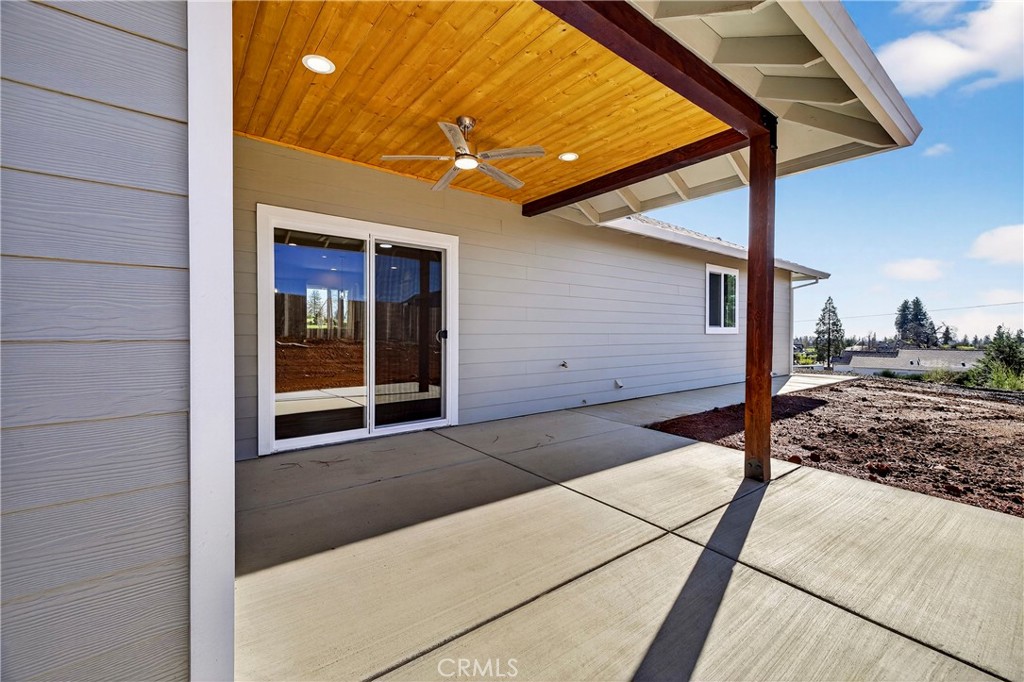 5617 Scottwood Road Paradise, CA 95969 - Photo 35 of 55 a view of a porch with a table and chairs