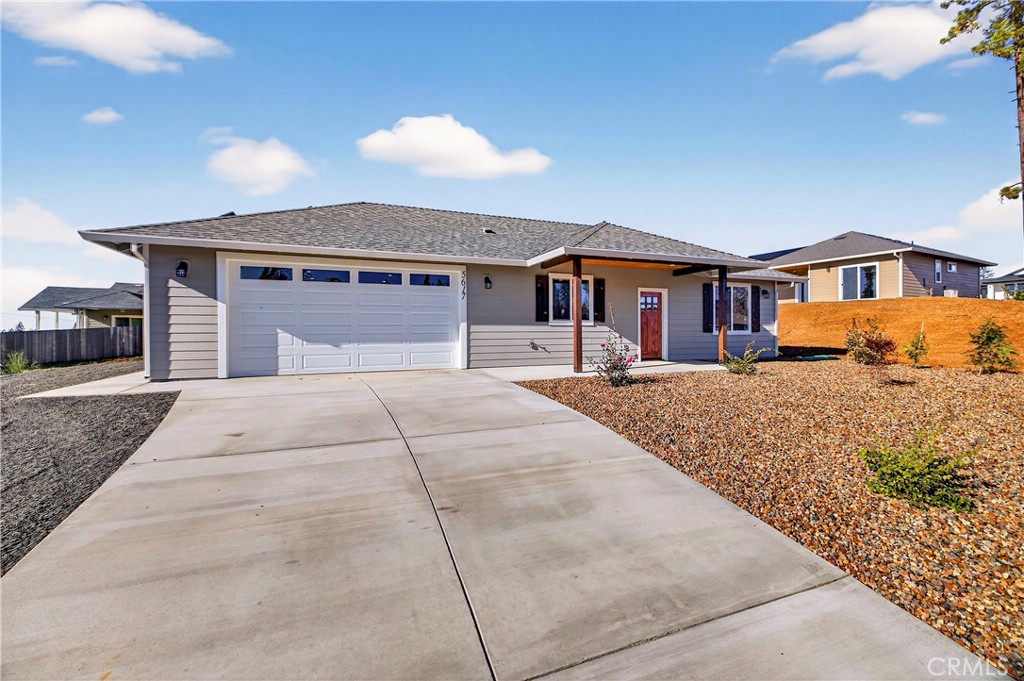 5617 Scottwood Road Paradise, CA 95969 - Photo 5 of 55 a front view of a house with a yard