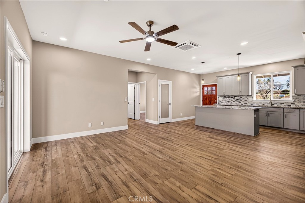5617 Scottwood Road Paradise, CA 95969 - Photo 8 of 55 a view of an empty room with window and wooden floor