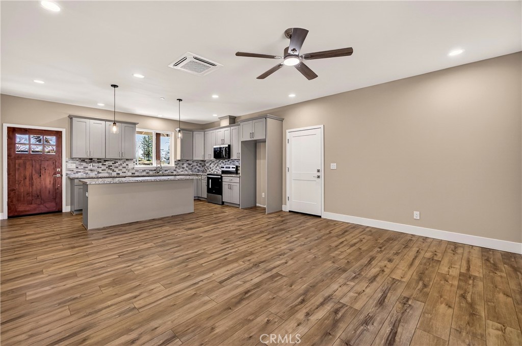 5617 Scottwood Road Paradise, CA 95969 - Photo 9 of 55 a view of a kitchen with a sink and a refrigerator