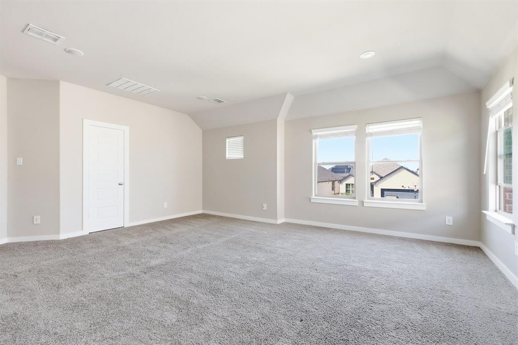 348 Braves Way Lavon, TX 75166 - Photo 15 of 26 an empty room with windows and mirror