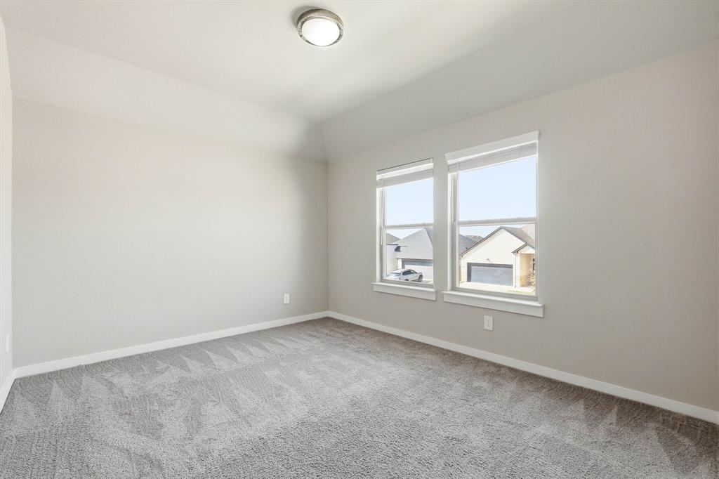 348 Braves Way Lavon, TX 75166 - Photo 18 of 26 an empty room with windows