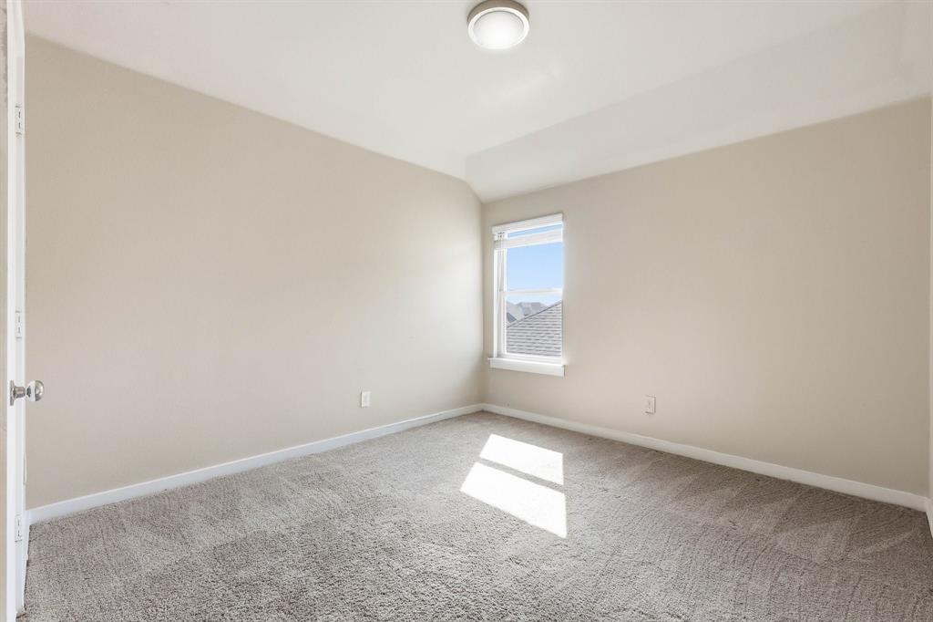 348 Braves Way Lavon, TX 75166 - Photo 22 of 26 an empty room with a empty space and a window