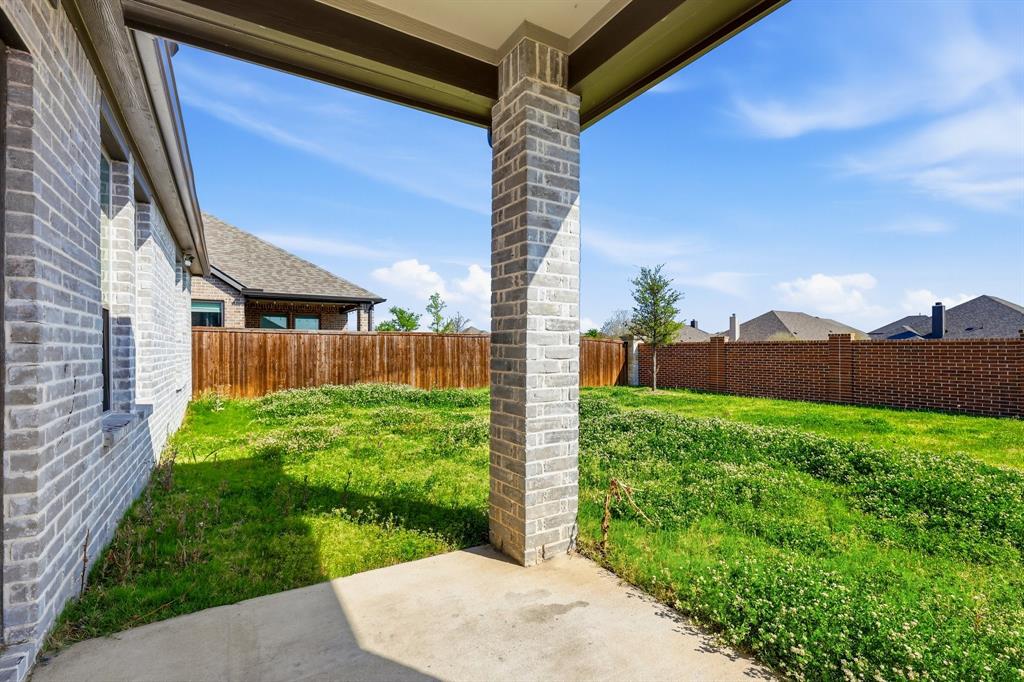 348 Braves Way Lavon, TX 75166 - Photo 24 of 26 a view of a backyard with a garden