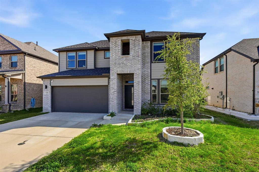 348 Braves Way Lavon, TX 75166 - Photo 26 of 26 a front view of a house with a yard