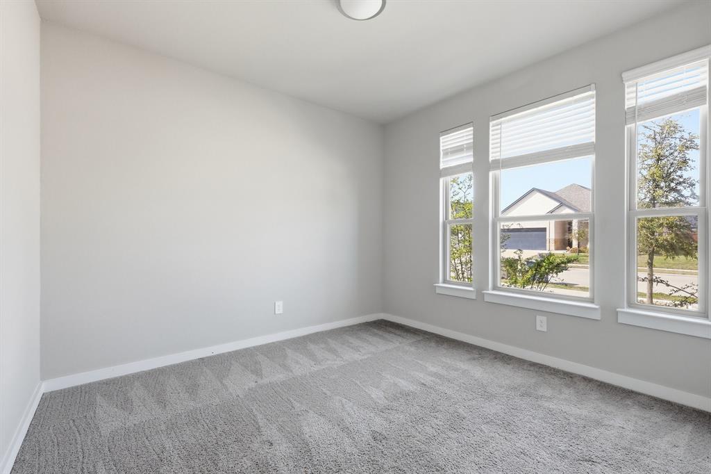 348 Braves Way Lavon, TX 75166 - Photo 8 of 26 an empty room with a window