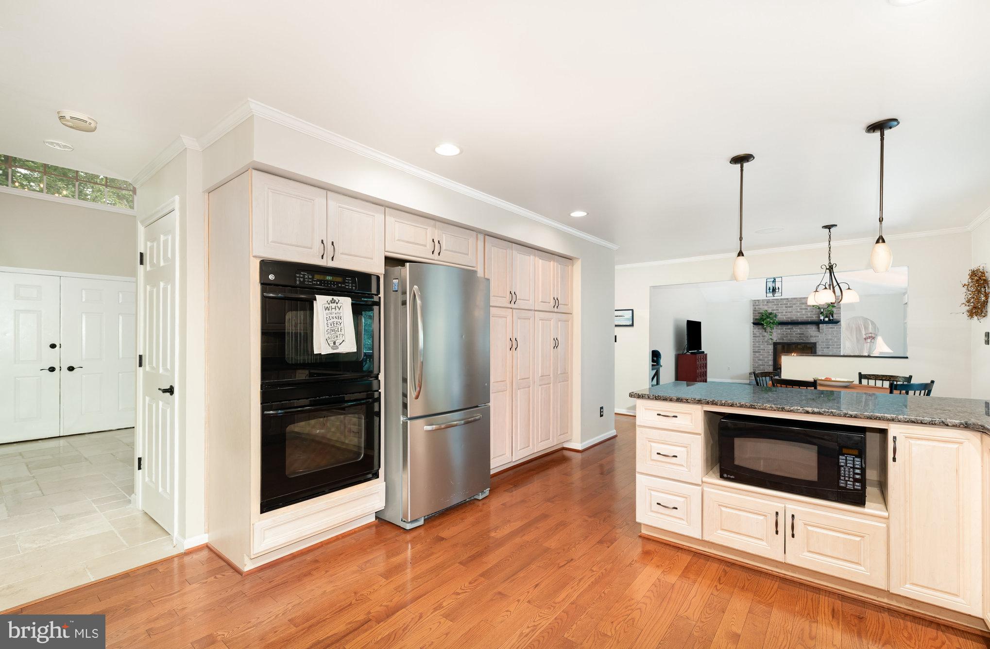 2736 Paper Mill Road Phoenix, MD 21131 - Photo 12 of 51 a kitchen with stainless steel appliances a stove a refrigerator and white cabinets