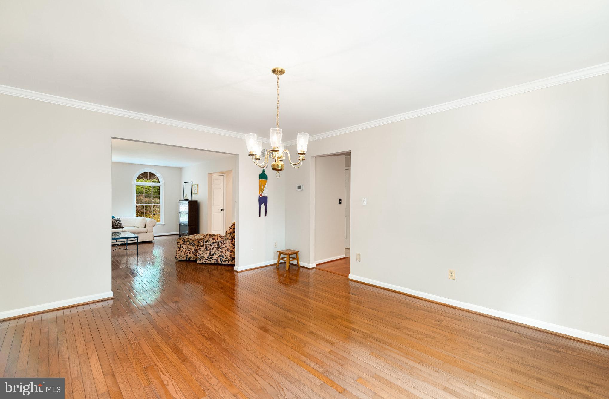 2736 Paper Mill Road Phoenix, MD 21131 - Photo 15 of 51 a view of empty room with wooden floor and stove