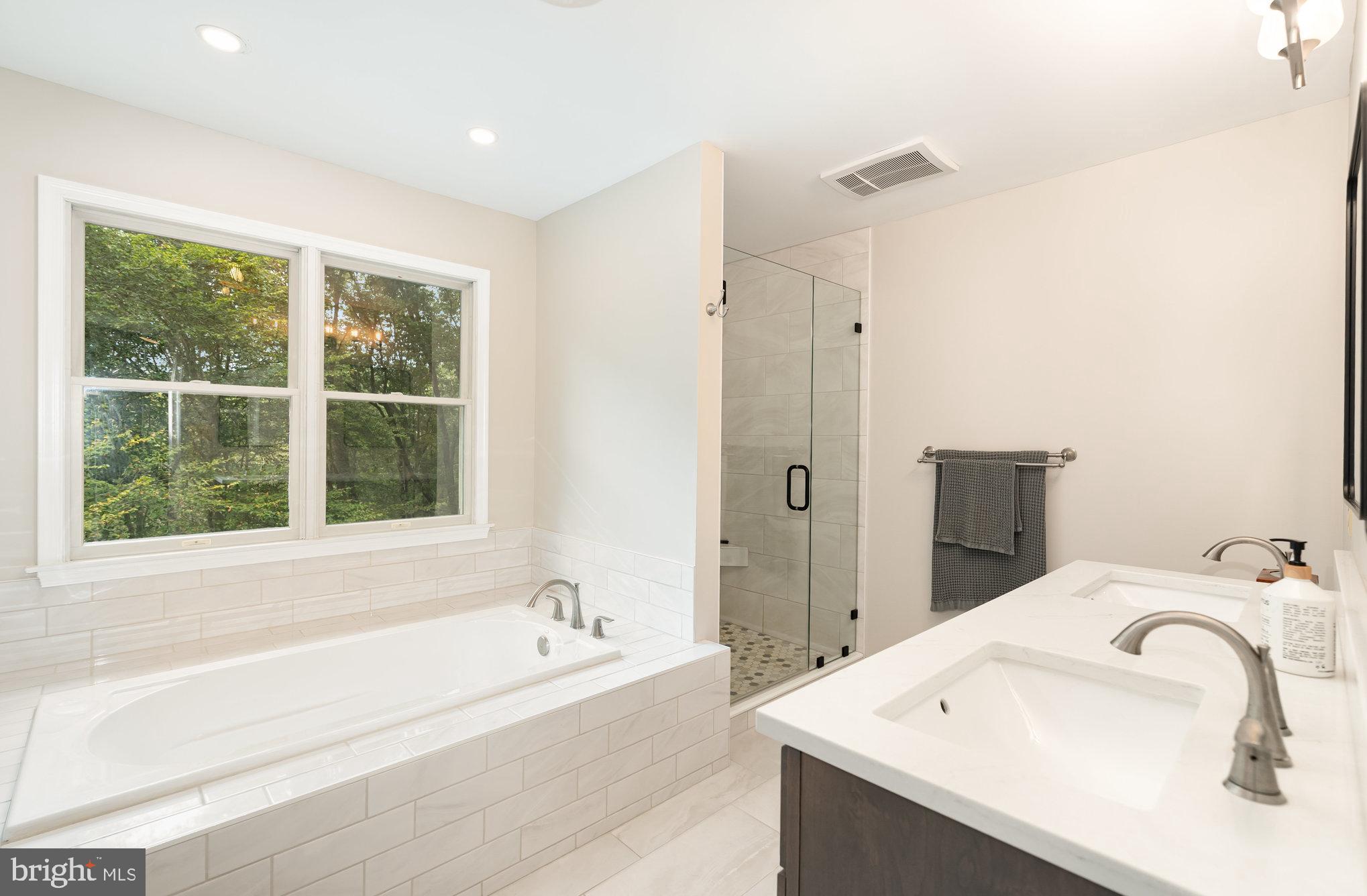 2736 Paper Mill Road Phoenix, MD 21131 - Photo 17 of 51 a bathroom with a tub sink and mirror