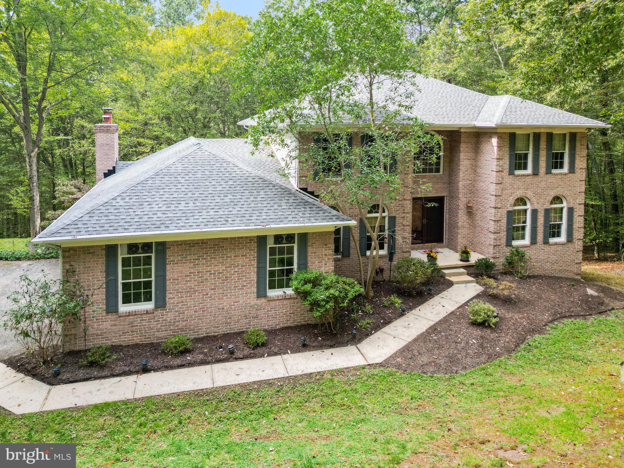 2736 Paper Mill Road Phoenix, MD 21131 - Photo 2 of 51 a front view of a house with a yard