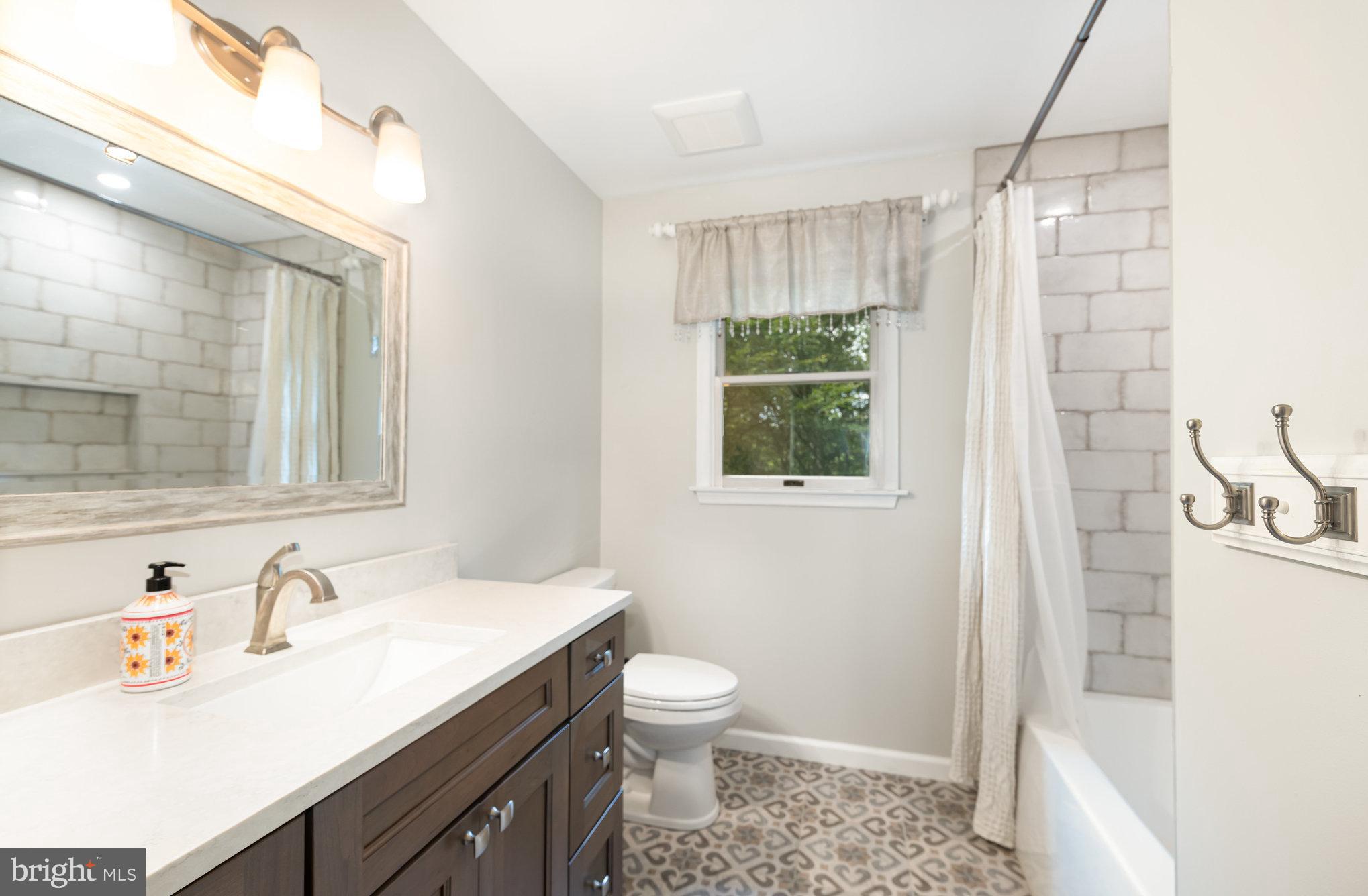 2736 Paper Mill Road Phoenix, MD 21131 - Photo 22 of 51 a bathroom with a sink a toilet and shower