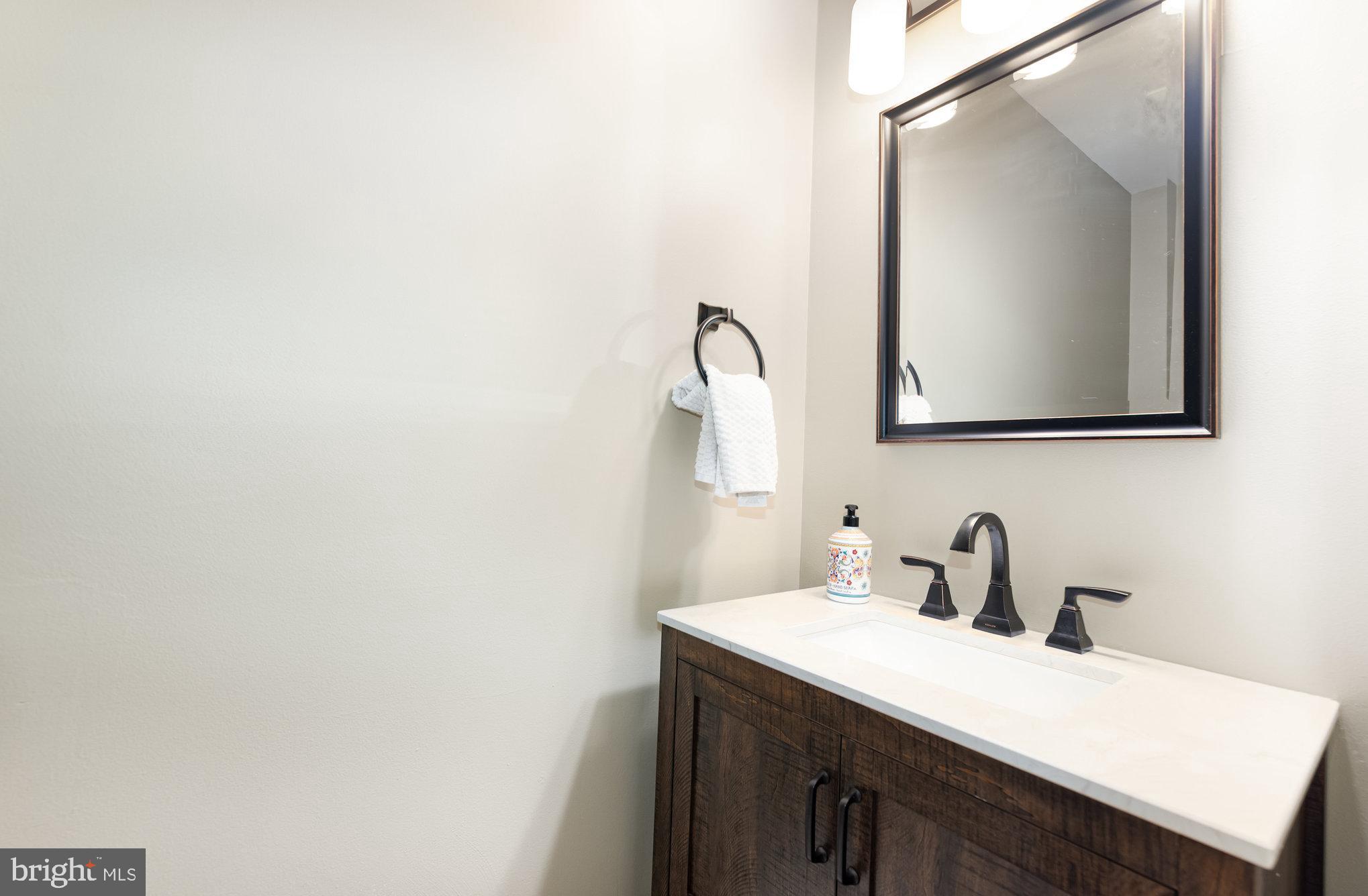 2736 Paper Mill Road Phoenix, MD 21131 - Photo 25 of 51 a bathroom with a sink and a mirror