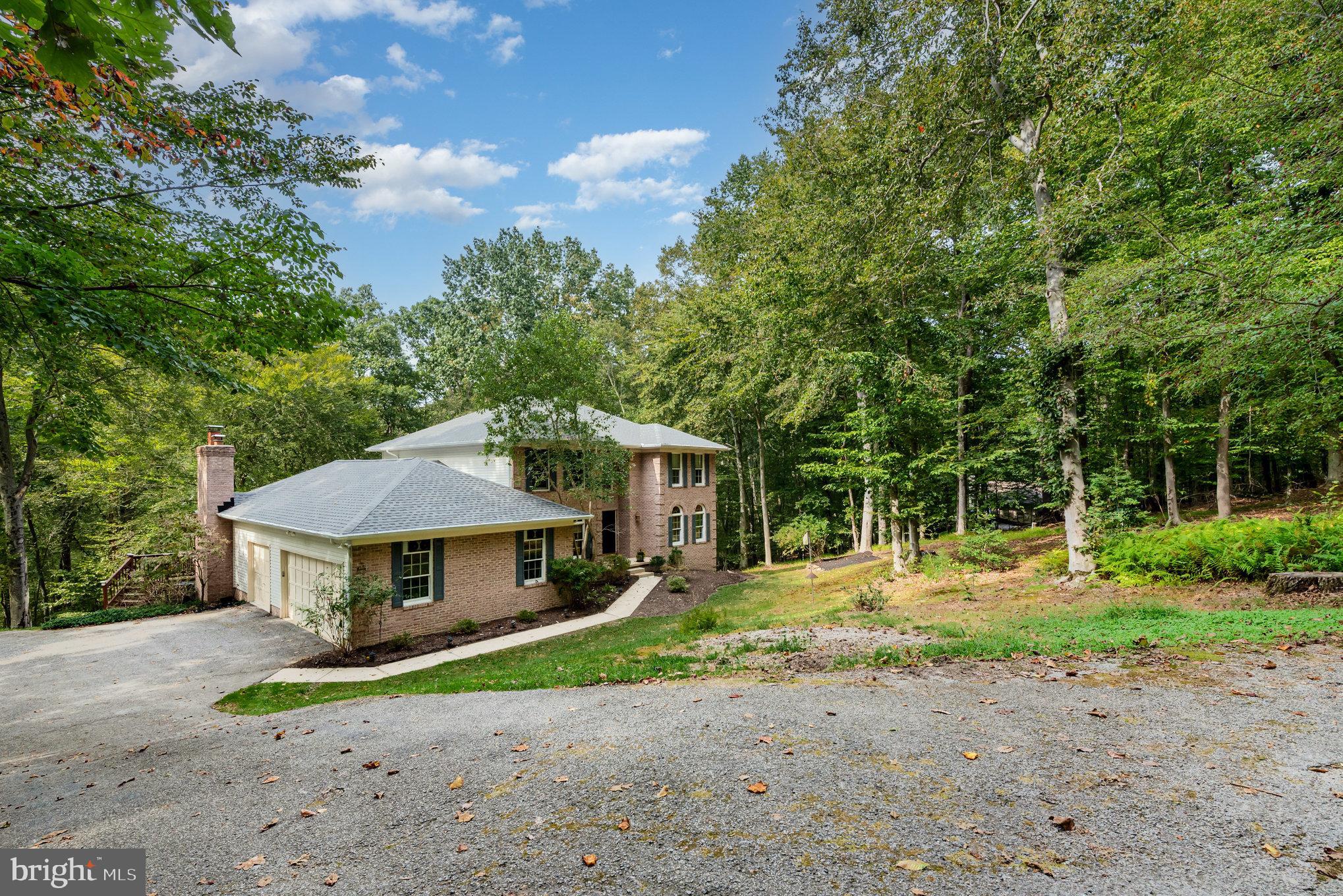 2736 Paper Mill Road Phoenix, MD 21131 - Photo 3 of 51 a house with trees in the background