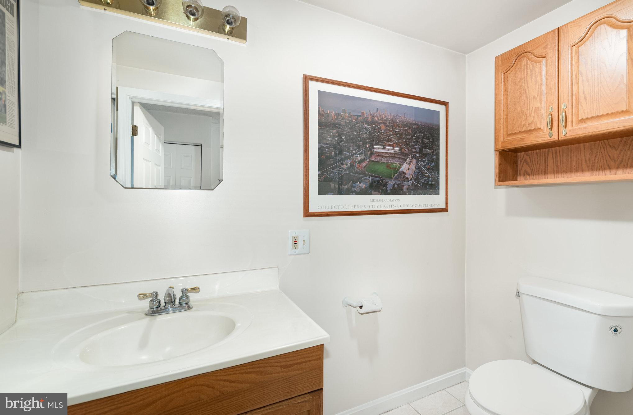 2736 Paper Mill Road Phoenix, MD 21131 - Photo 37 of 51 a bathroom with a sink mirror and toilet