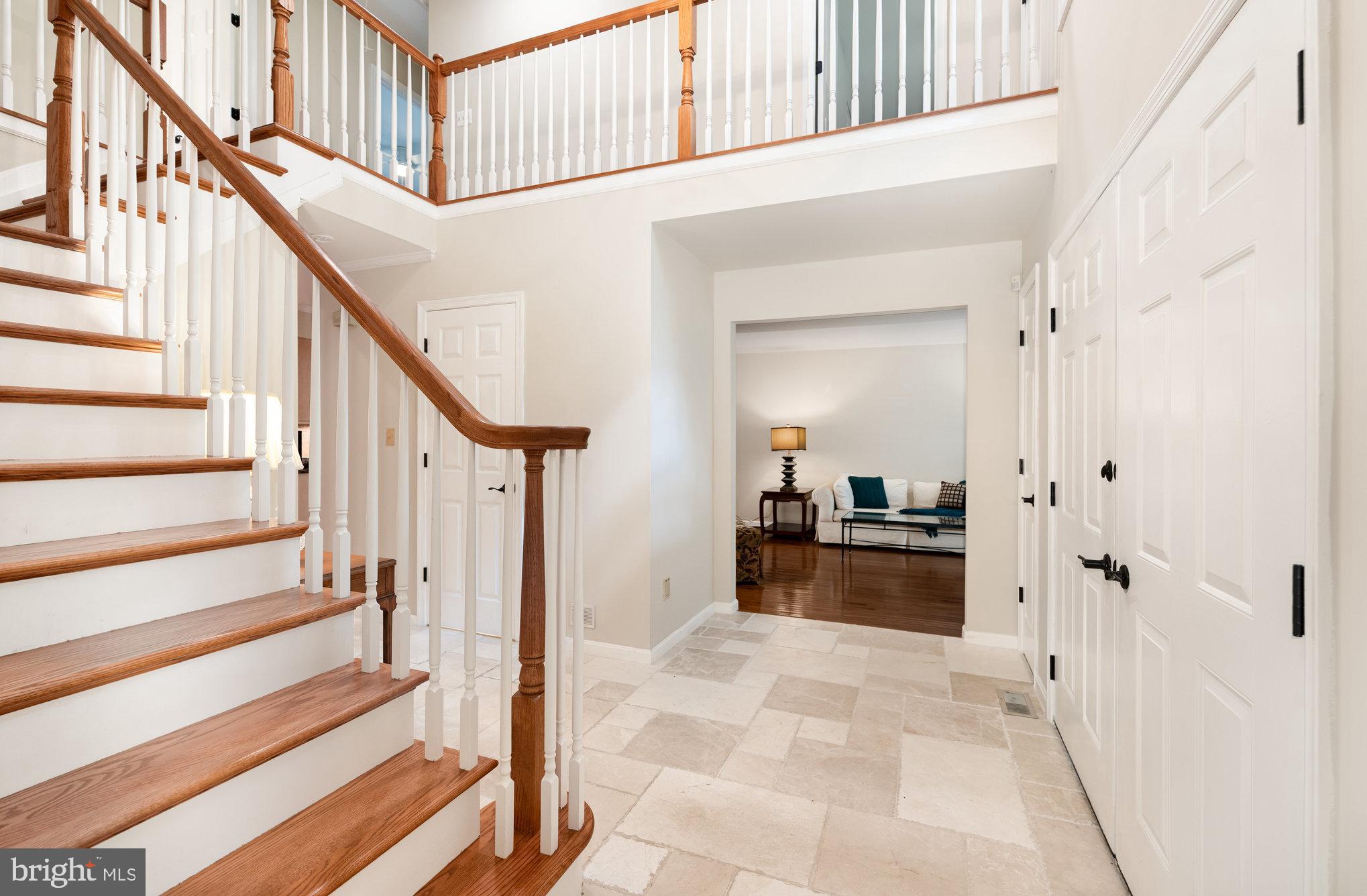 2736 Paper Mill Road Phoenix, MD 21131 - Photo 5 of 51 a view of a hallway with wooden floor and staircase