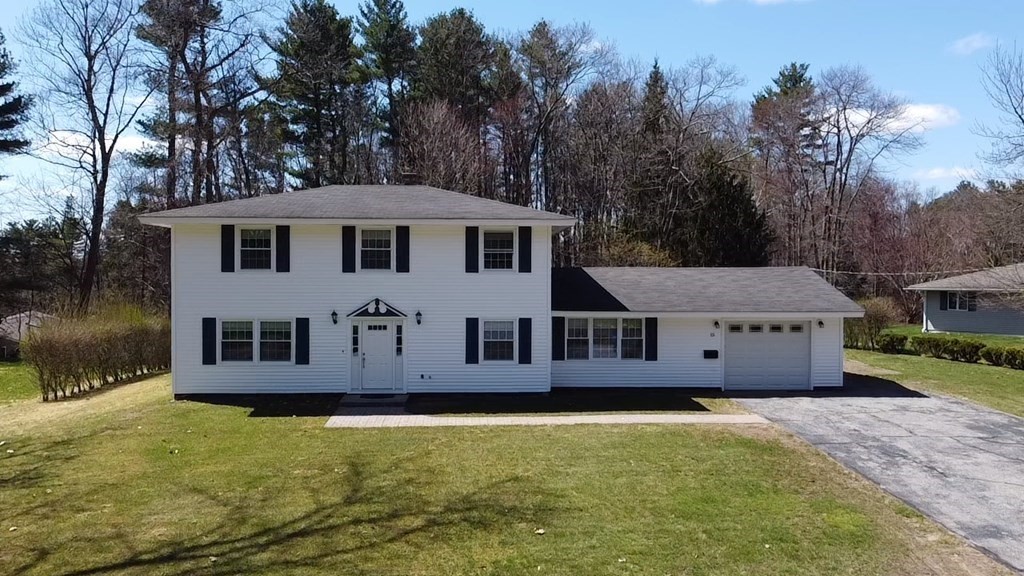 15 Ruthellen Road Chelmsford, MA 01824 - Photo 1 of 34 a view of a house with a garden and trees