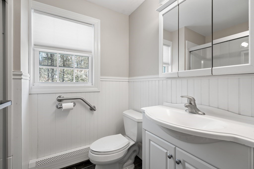 15 Ruthellen Road Chelmsford, MA 01824 - Photo 14 of 34 a bathroom with a sink a toilet and a window