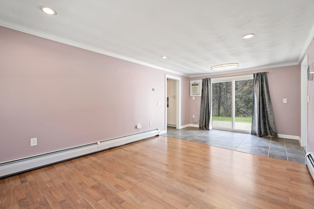 15 Ruthellen Road Chelmsford, MA 01824 - Photo 16 of 34 a view of an empty room with wooden floor and a window