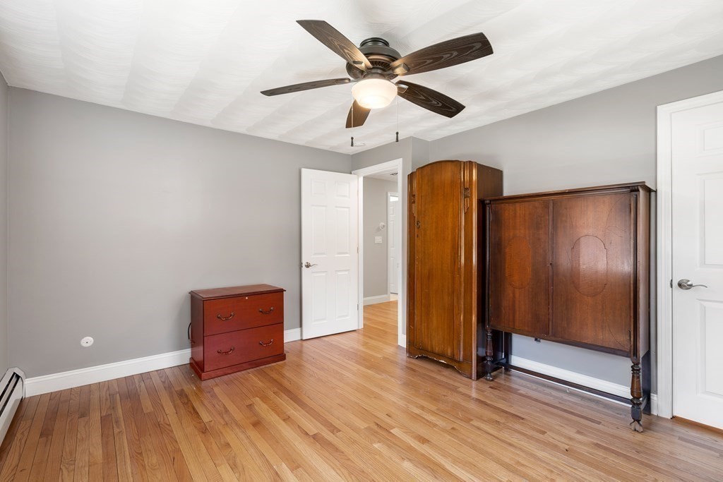 15 Ruthellen Road Chelmsford, MA 01824 - Photo 18 of 34 a view of an empty room with wooden floor
