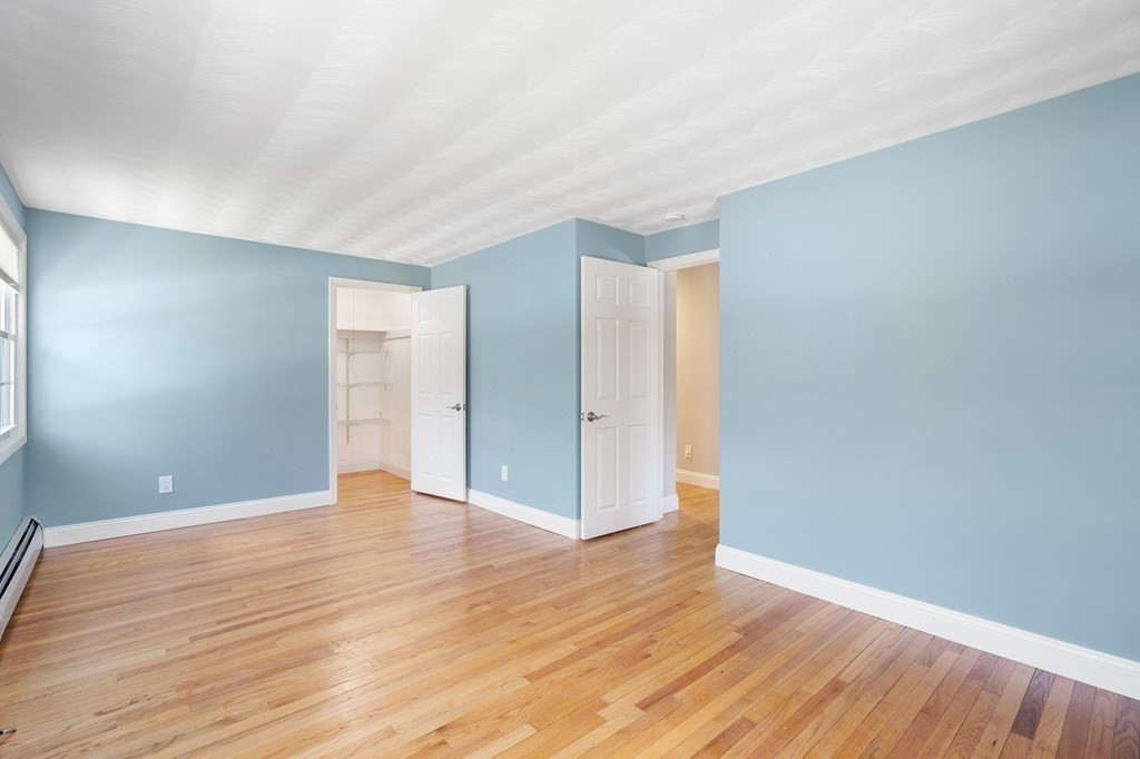 15 Ruthellen Road Chelmsford, MA 01824 - Photo 24 of 34 a view of an empty room with wooden floor