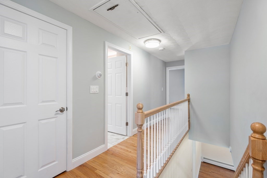 15 Ruthellen Road Chelmsford, MA 01824 - Photo 26 of 34 a view of a hallway with wooden floor and staircase