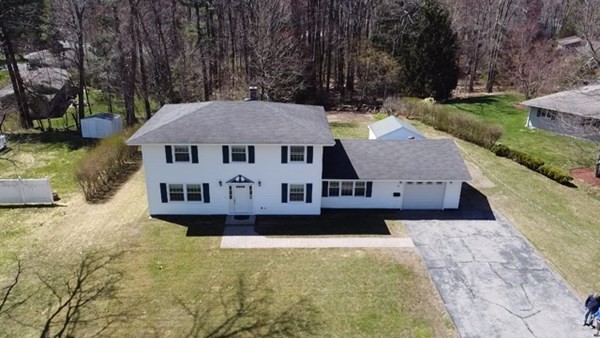15 Ruthellen Road Chelmsford, MA 01824 - Photo 3 of 34 an aerial view of a house with swimming pool and a yard