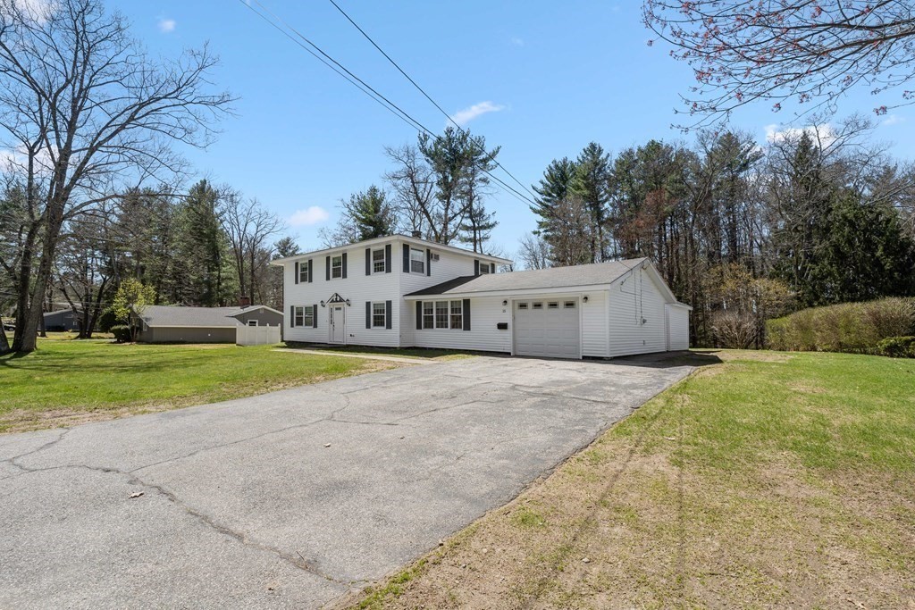 15 Ruthellen Road Chelmsford, MA 01824 - Photo 33 of 34 a house with trees in the background