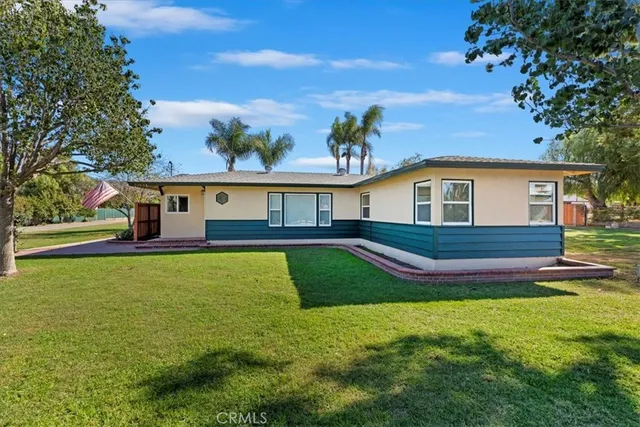 a view of a swimming pool with a table and chairs