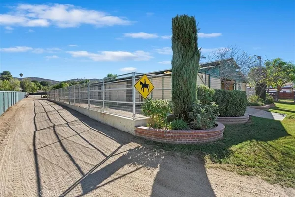 a view of a road with a building in the background