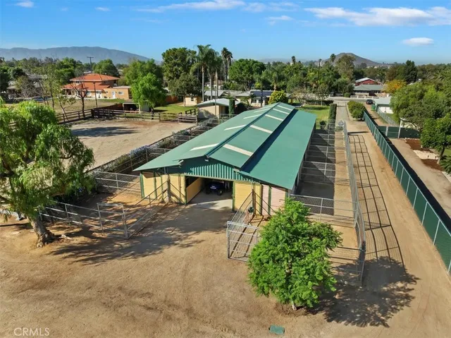 a view of a swimming pool with a table and chairs
