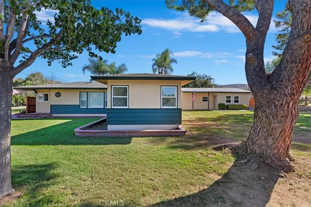 a view of empty room with wooden floor and outdoor space