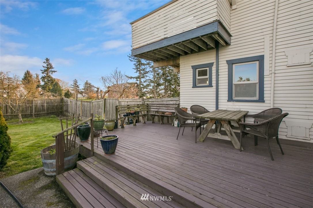 16573 Beaver Marsh Road Mount Vernon, WA 98273 - Photo 12 of 30 a view of a patio with table and chairs with wooden floor and fence