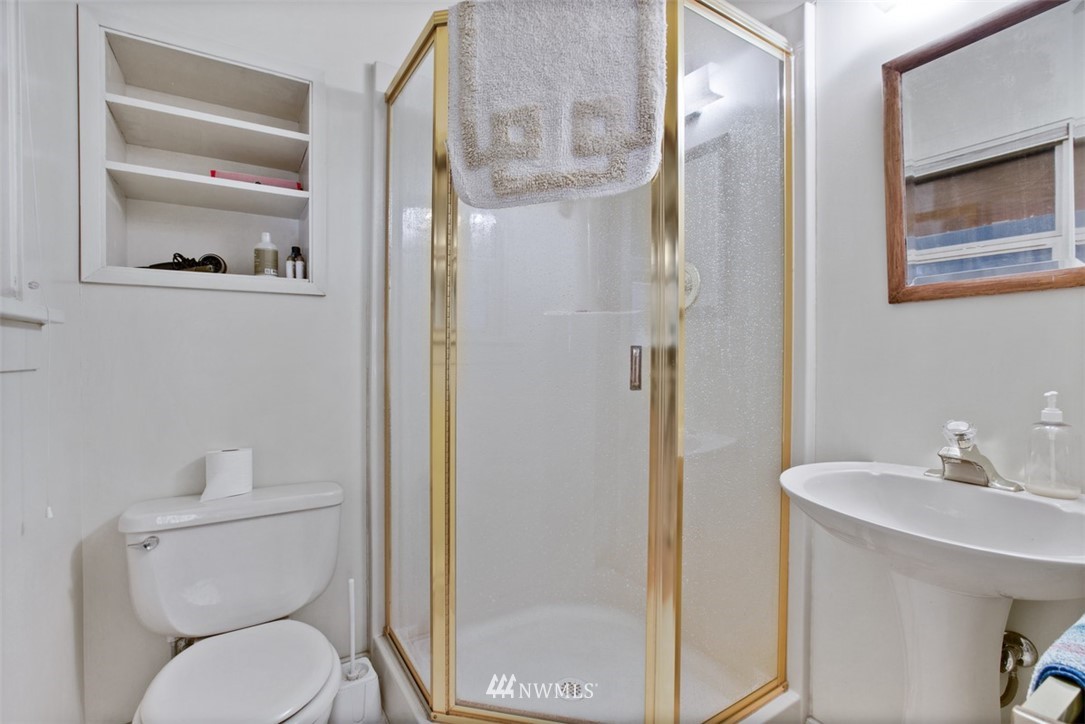 16573 Beaver Marsh Road Mount Vernon, WA 98273 - Photo 27 of 30 a bathroom with a toilet a sink and glass door