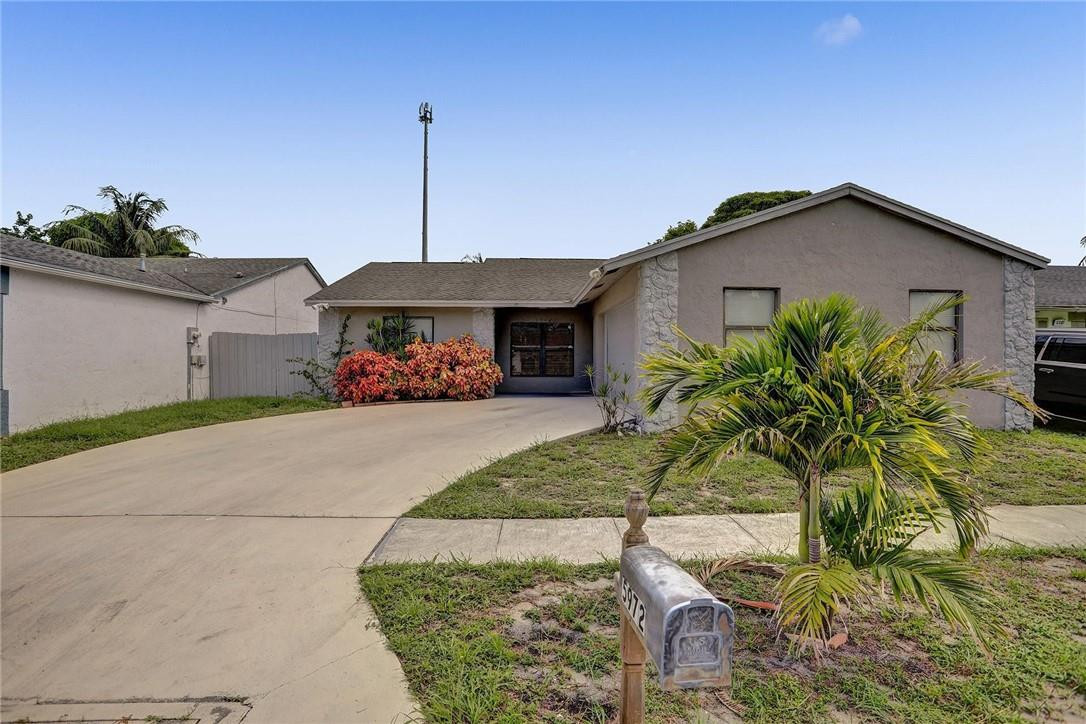 5972 Triphammer Road Lake Worth, FL 33463 - Photo 3 of 26 EXTERIOR FRONT