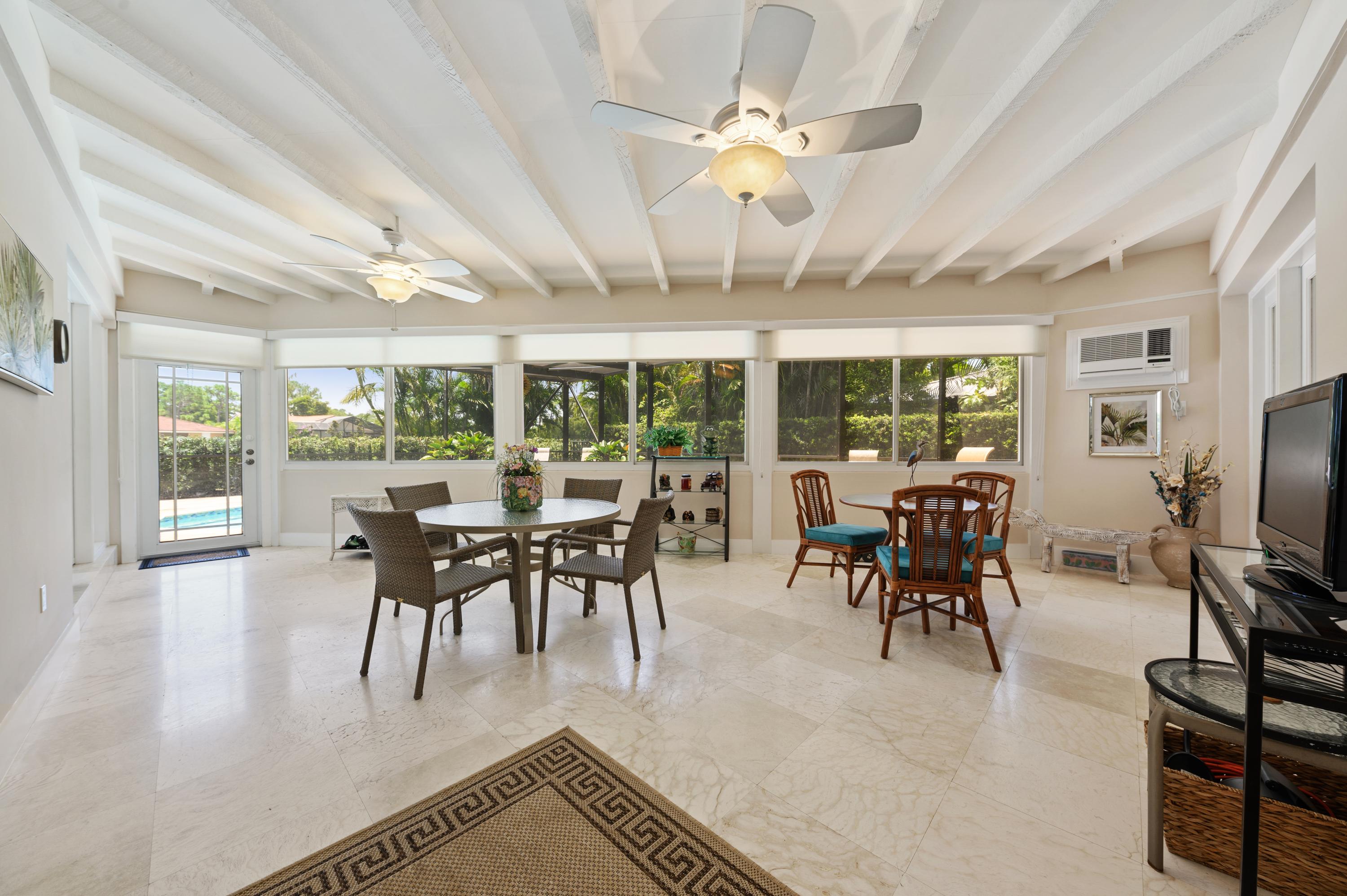 913 Foxpointe Circle Delray Beach, FL 33445 - Photo 11 of 21 06_913FoxpointeCircle_97_SunRoom_HiRes