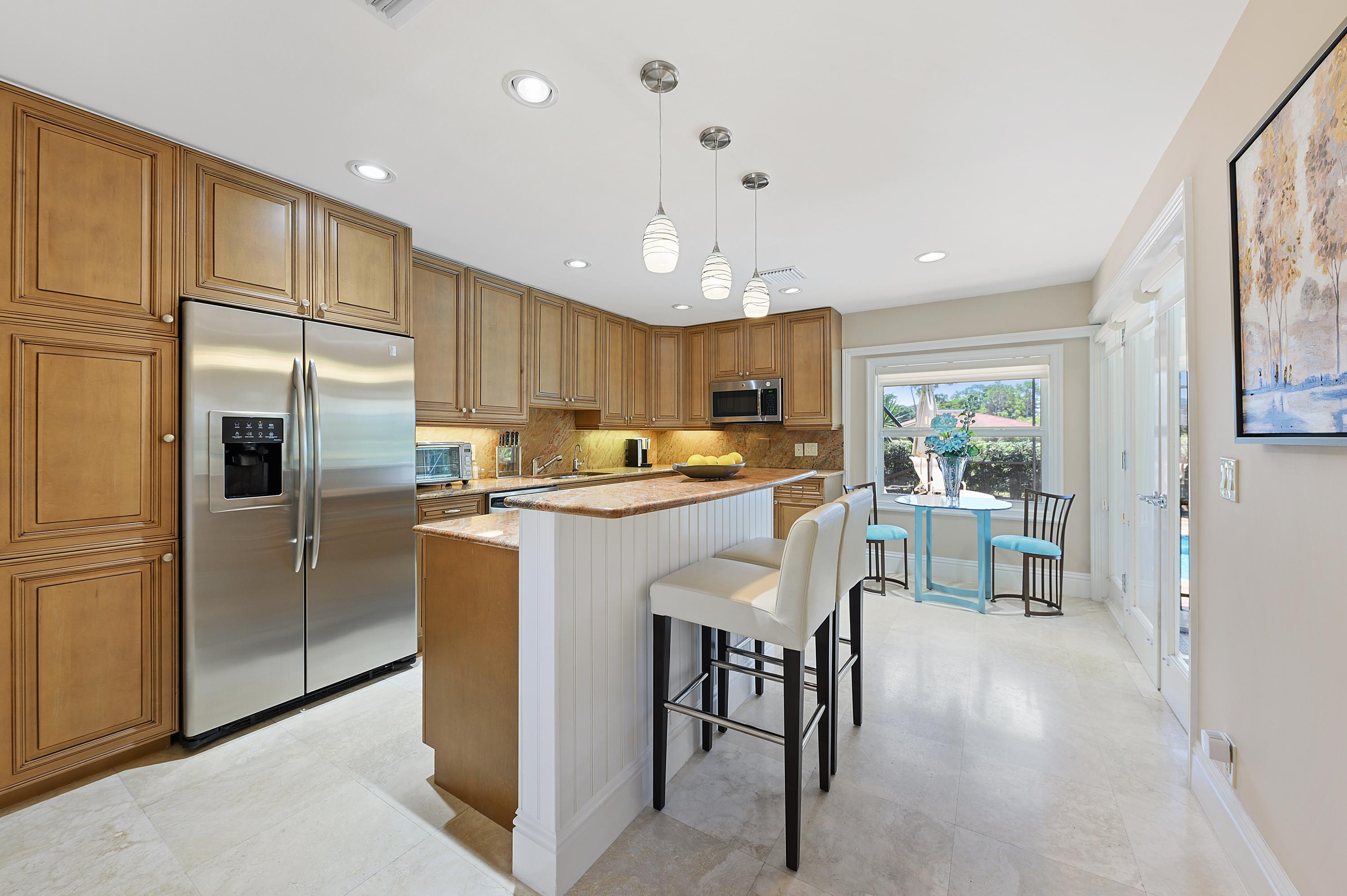 913 Foxpointe Circle Delray Beach, FL 33445 - Photo 5 of 21 05_913FoxpointeCircle_191_KitchenBreakfa