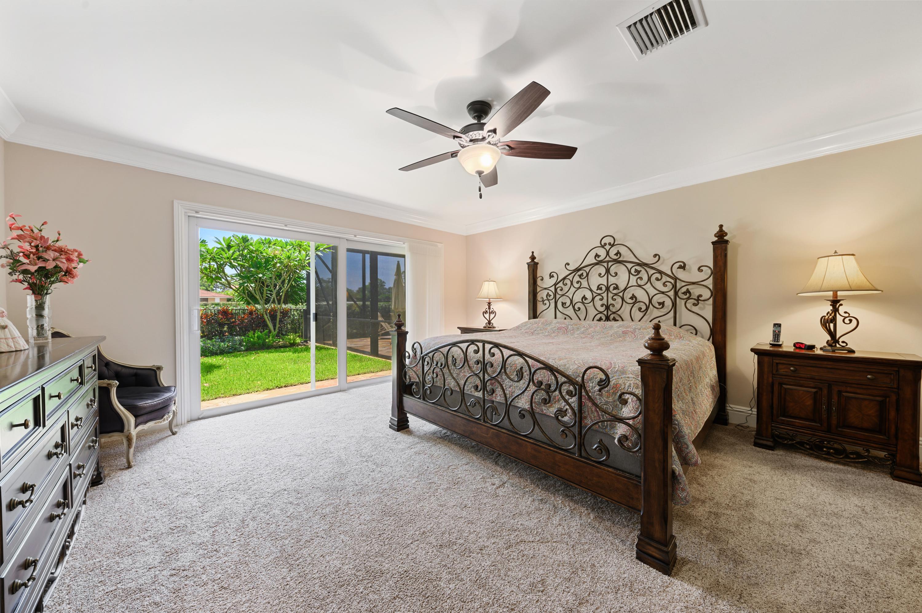 913 Foxpointe Circle Delray Beach, FL 33445 - Photo 6 of 21 07_913FoxpointeCircle_14_MasterBedroom_H