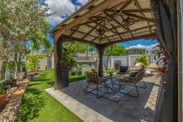 a view of yard with patio