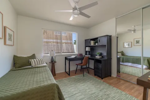a bedroom with furniture and a window