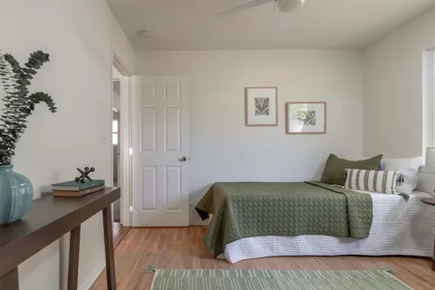 a bedroom with a bed and a window