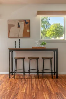 a view of a room with furniture and window