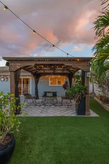 a front view of house with yard and seating area