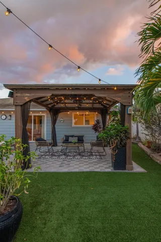 a front view of house with yard and seating area