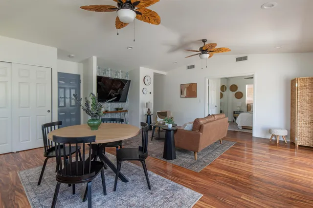 a view of a livingroom with furniture and a table